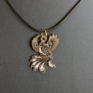 Elegant Gold and Black Phoenix Pendant Necklace